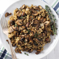 Savory steel cut oats ona white plate.