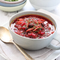Beetroot soup with beans in a bowl.