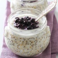 Overnight steel-cut oats in a glass jar.
