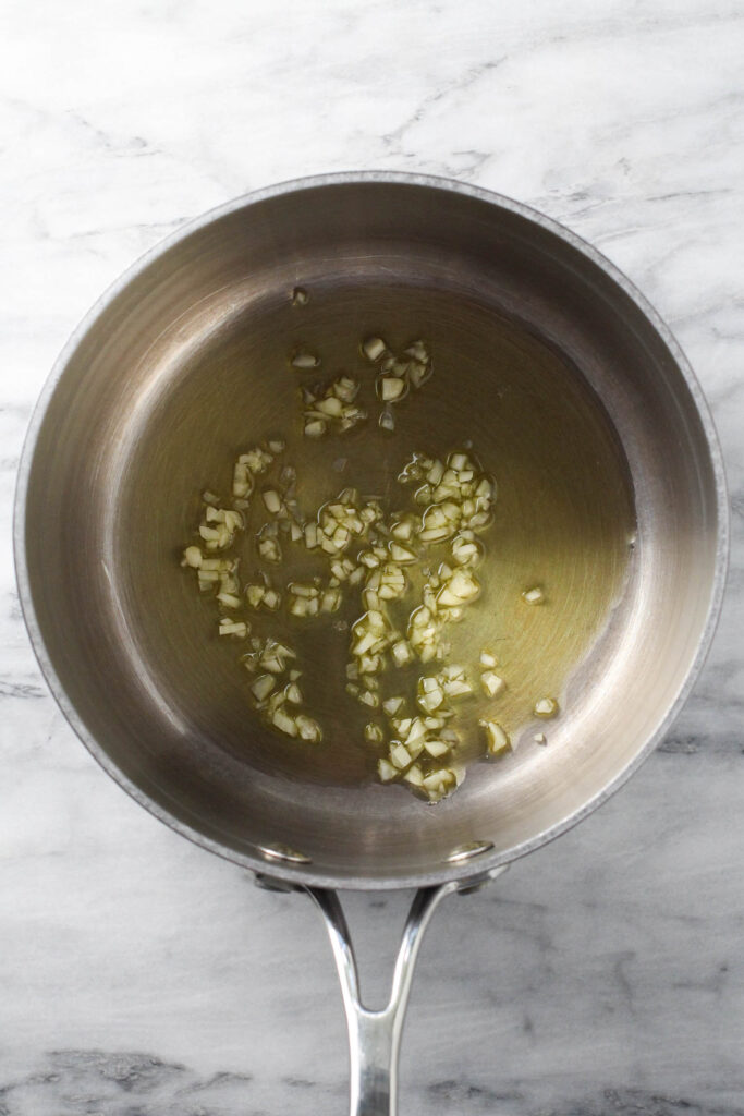 Olive oil and minced garlic in saucepan.