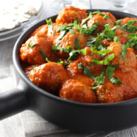 Meatballs in sauce in a bowl.