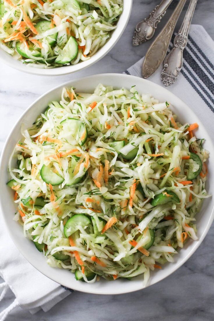 Overhead shot of the cabbage cucumber salad in a bowl.