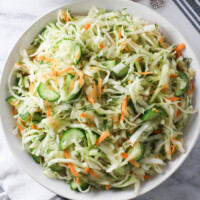 Cabbage cucumber salad in a bowl.