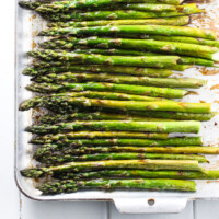 Roasted asparagus on a baking sheet.