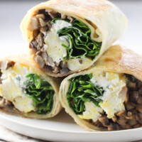 Sliced mushroom wrap on a plate.