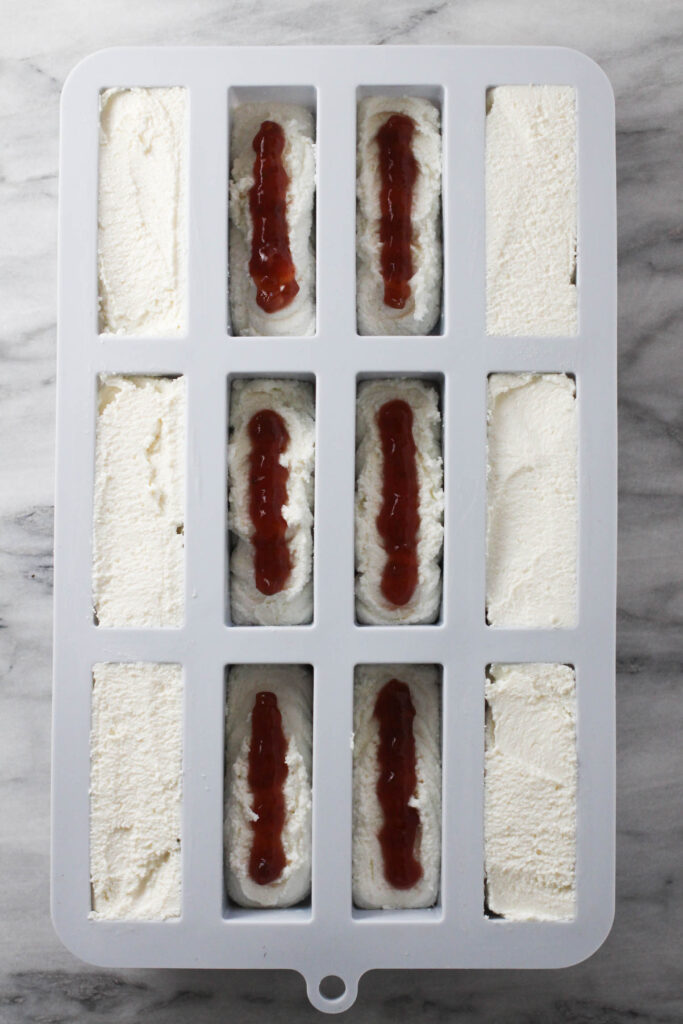 Cheese mixture piped into a silicon mold.