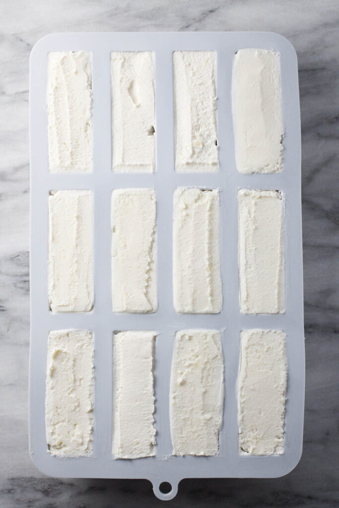 A silicon mold filled with the cheese mixture.