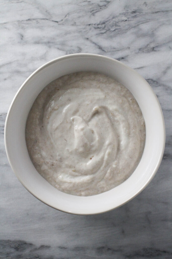 Mixed banana puree and yogurt in a bowl.
