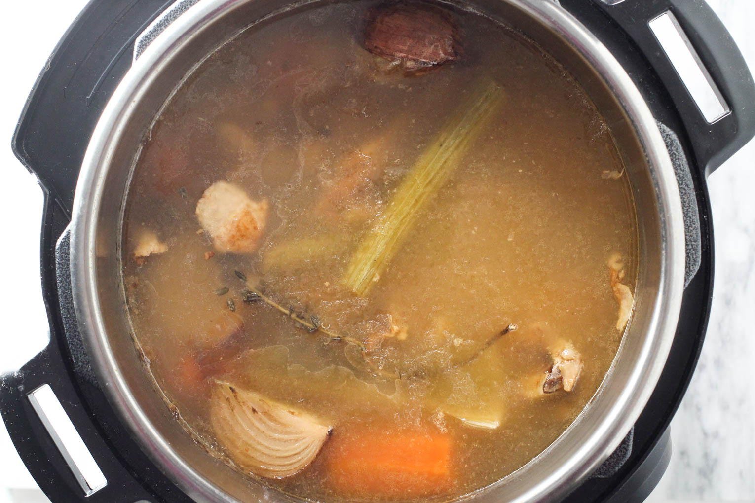 Cooked turkey bone broth inside the Instant Pot.