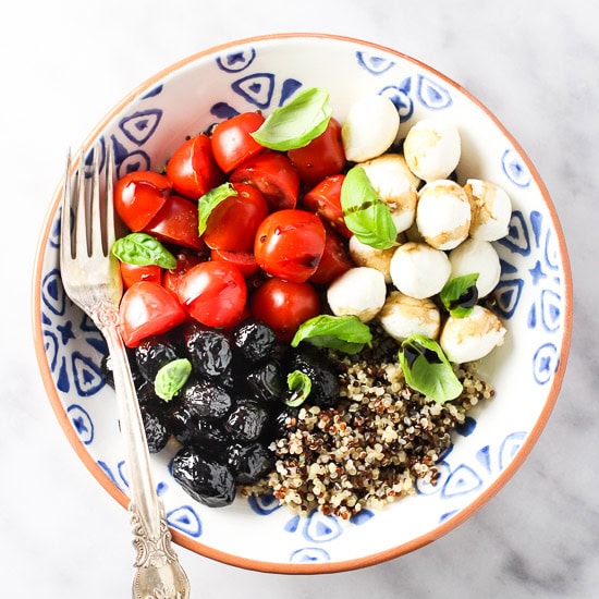 Caprese quinoa bowl on a plate.