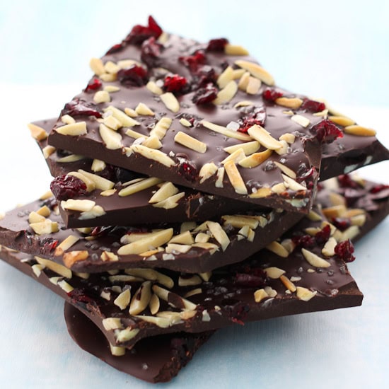 Pieces of dark chocolate bark stucked on top of each other.