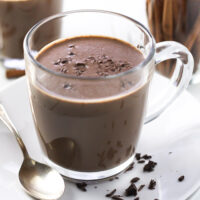 Cinnamon hot chocolate in a glass mug.