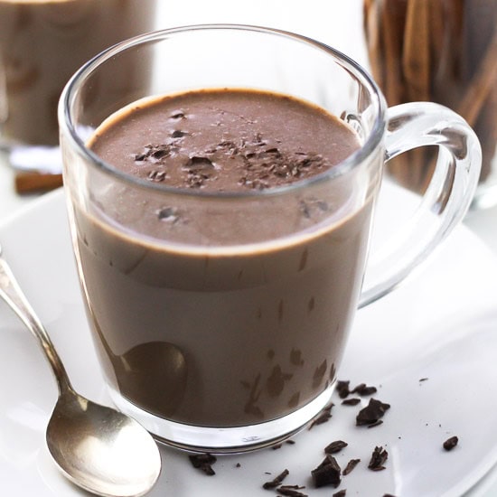 Cinnamon hot chocolate in a glass mug.