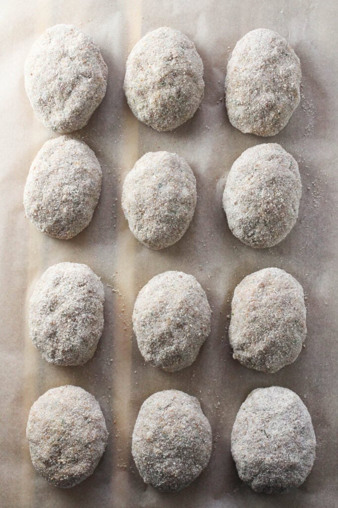 Breaded Russian meat cutlets arranged on a tray.