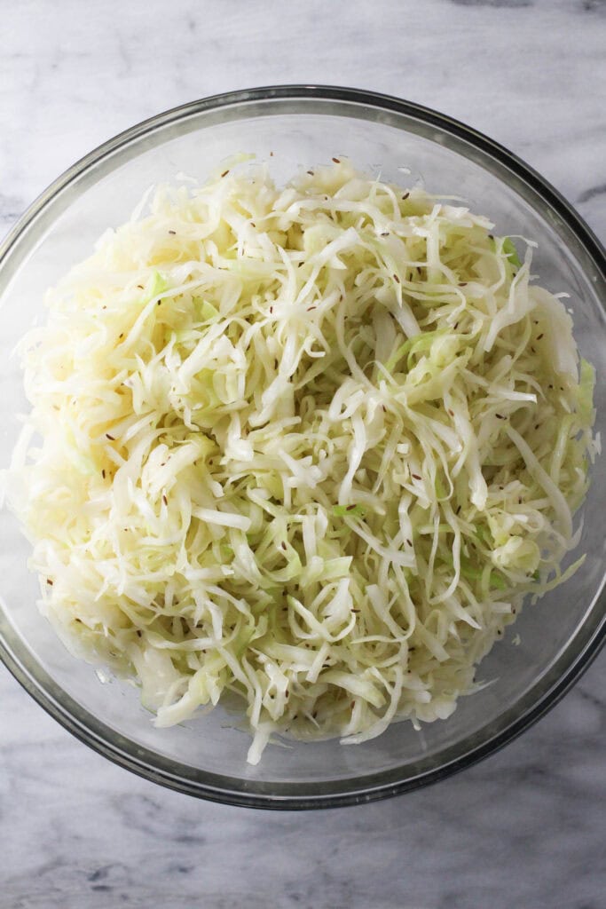 Shredded cabbage tossed with vinegar dressing and caraway seeds.