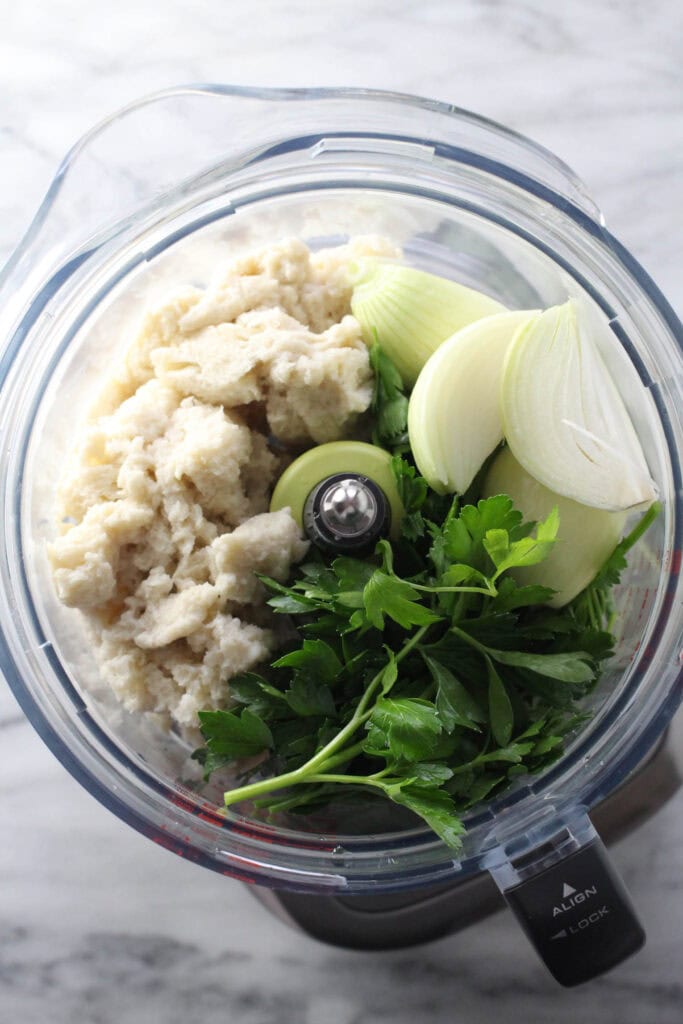 Parsley, onion, and soaked bread in a blender for kotlety mixture.